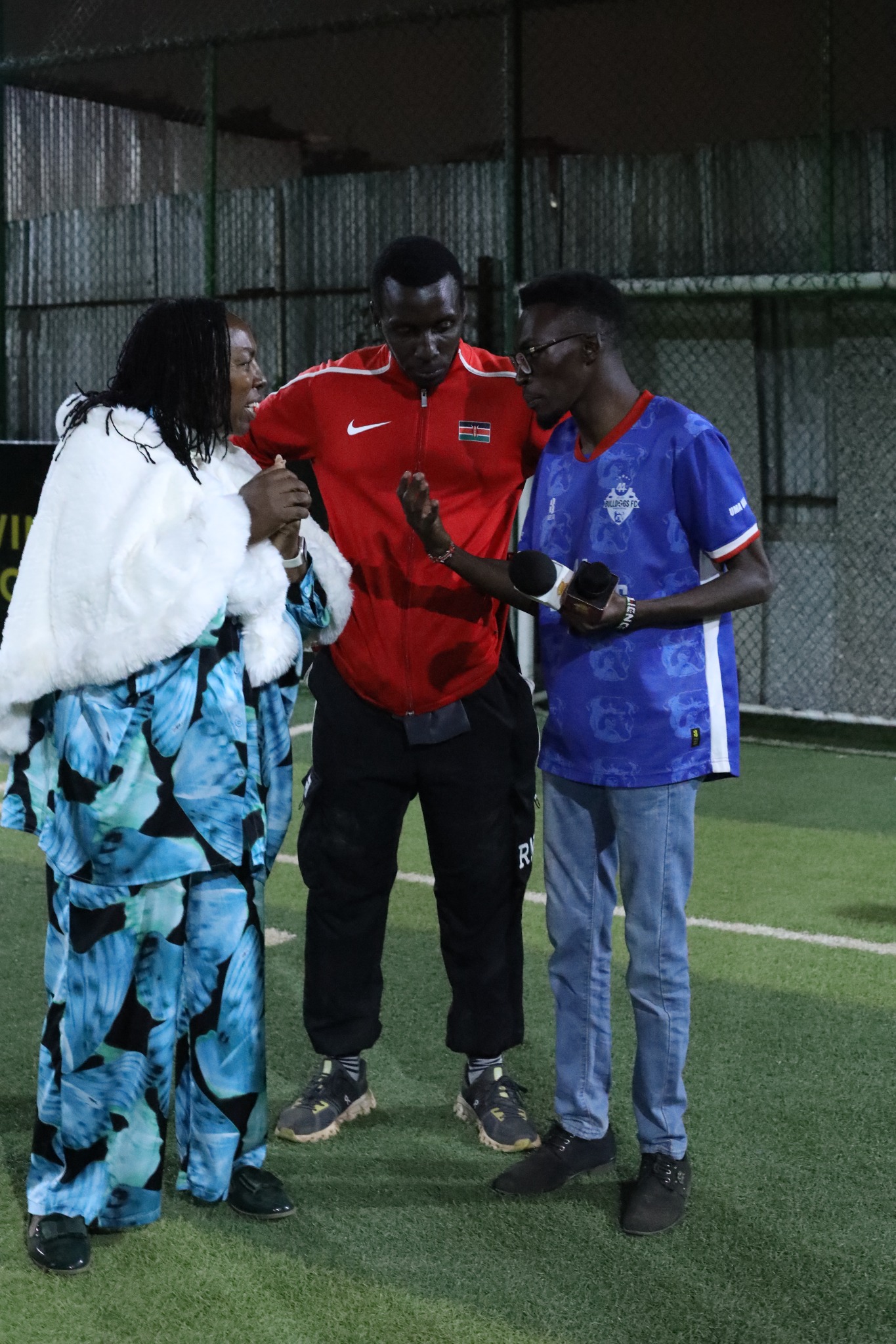 Munala at a community football event