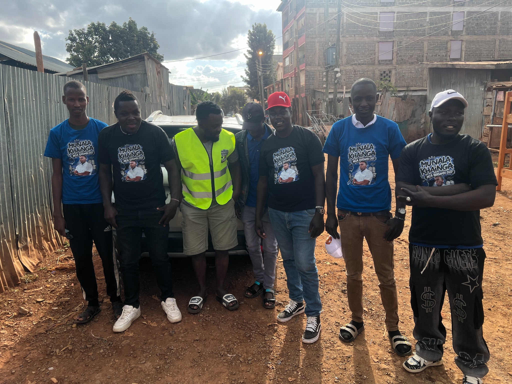 Munala with members of the Tufix Mtaa team