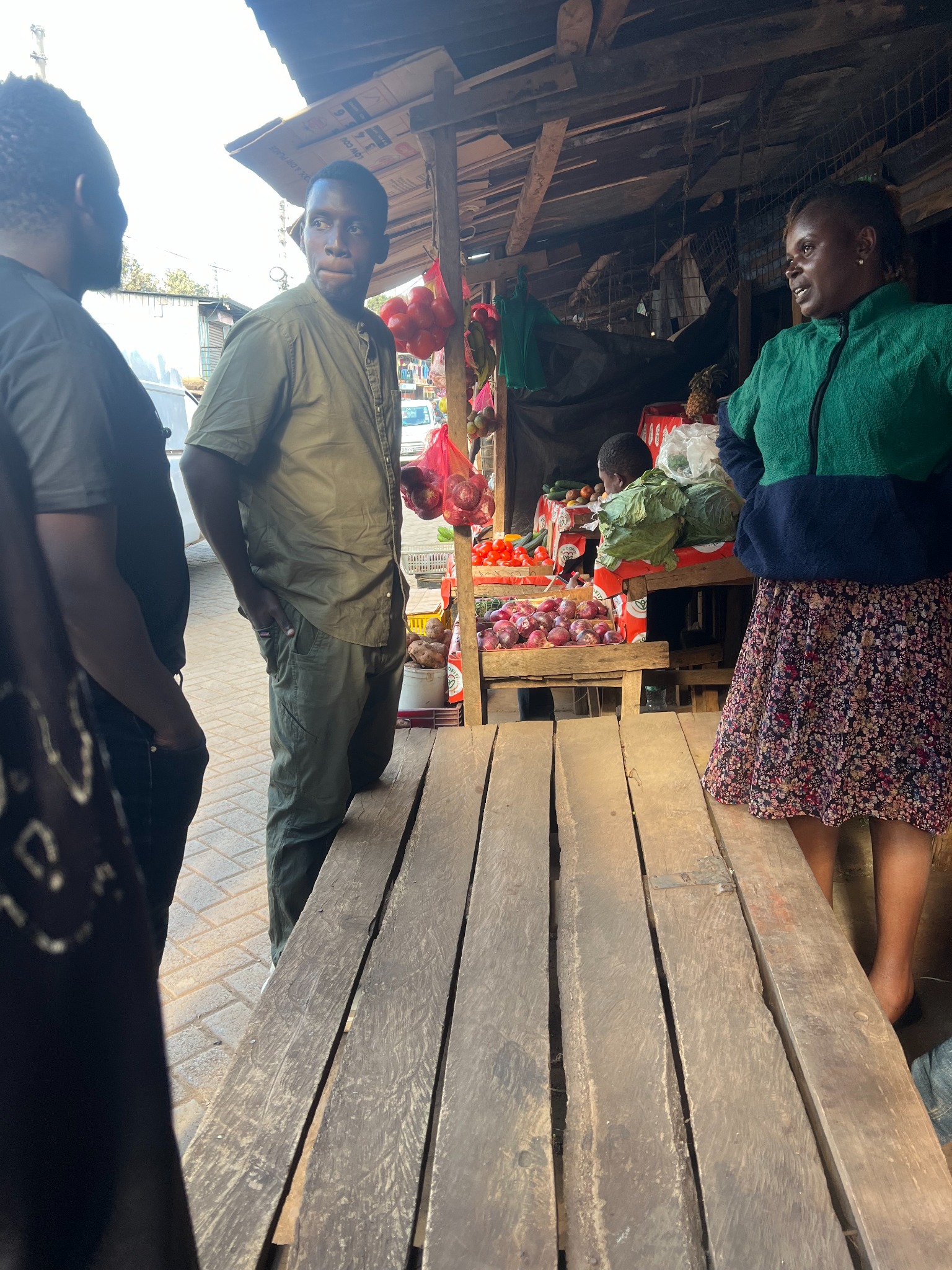 Munala in conversation with a trader in Roysambu