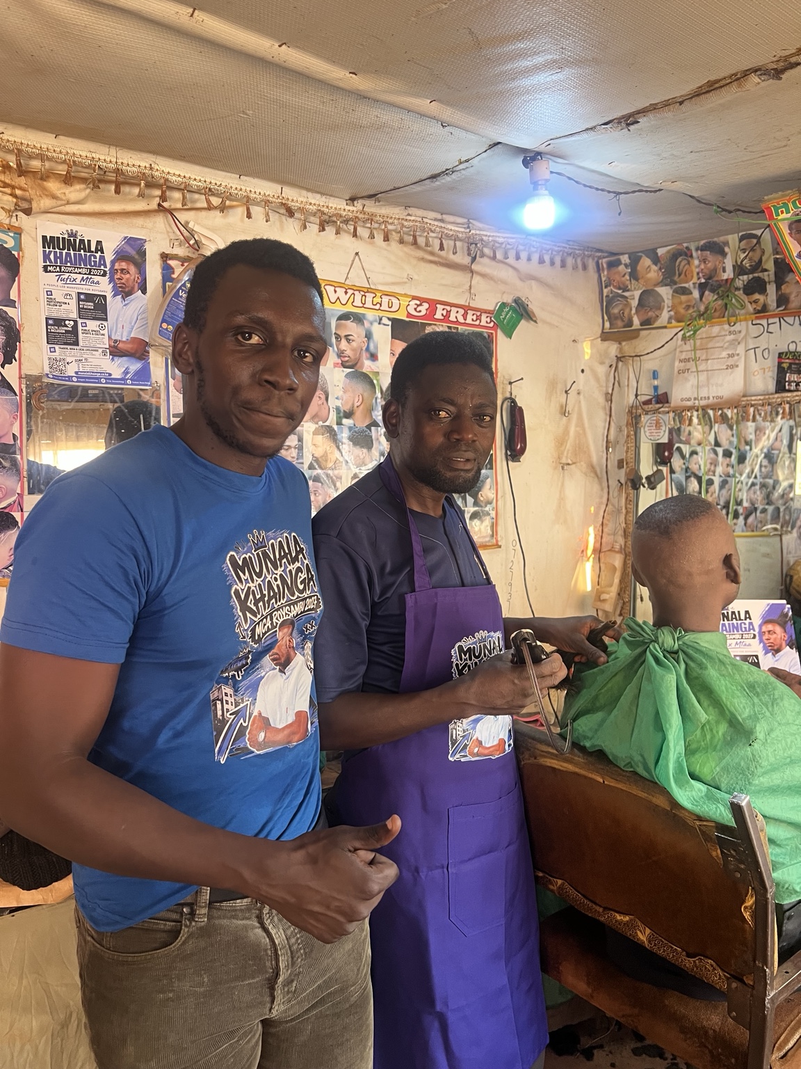 Munala with a Roysambu barber wearing a Tufix Mtaa work apron