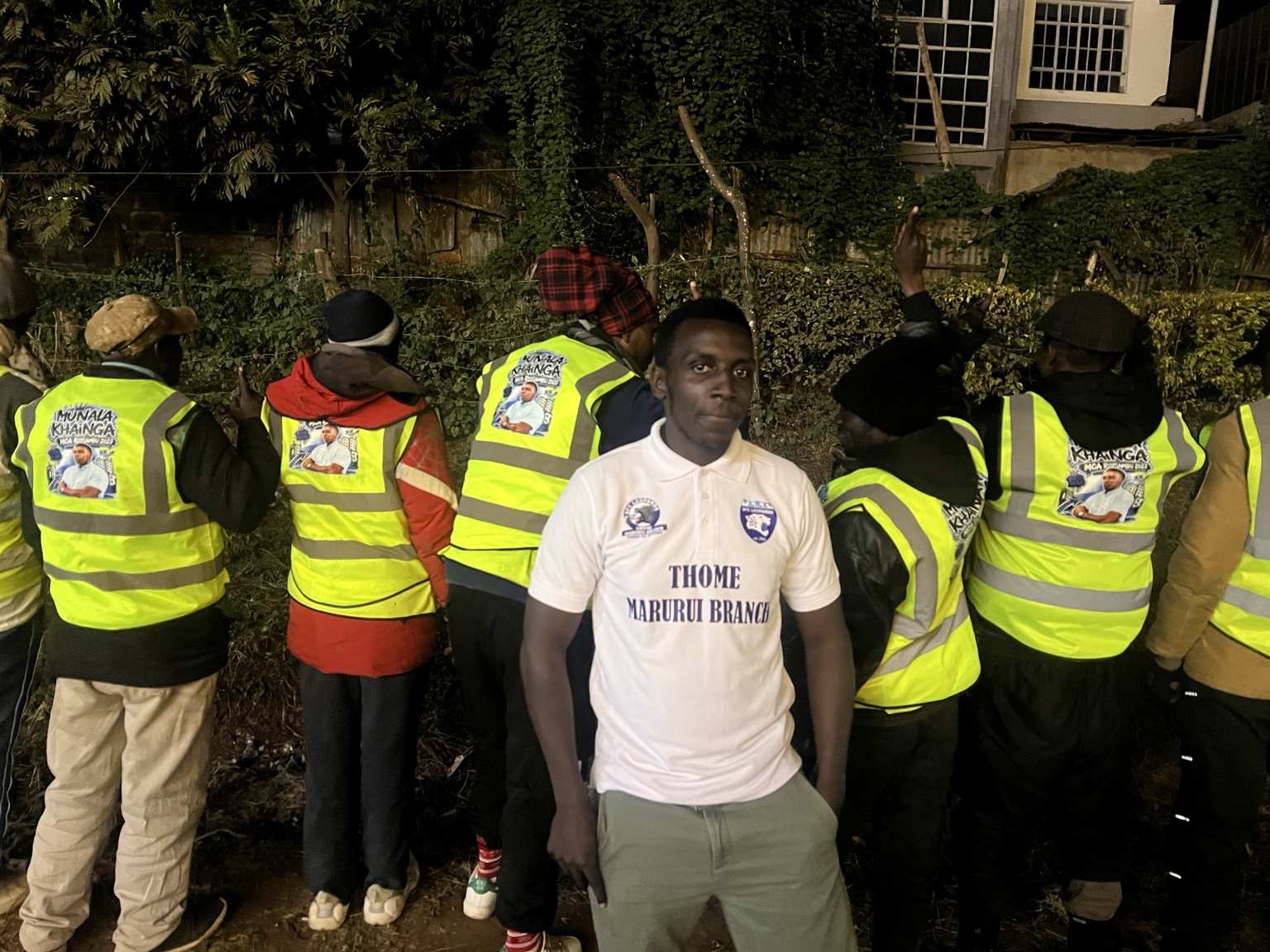 Munala and the Tufix Mtaa ground team wearing reflective jackets at night